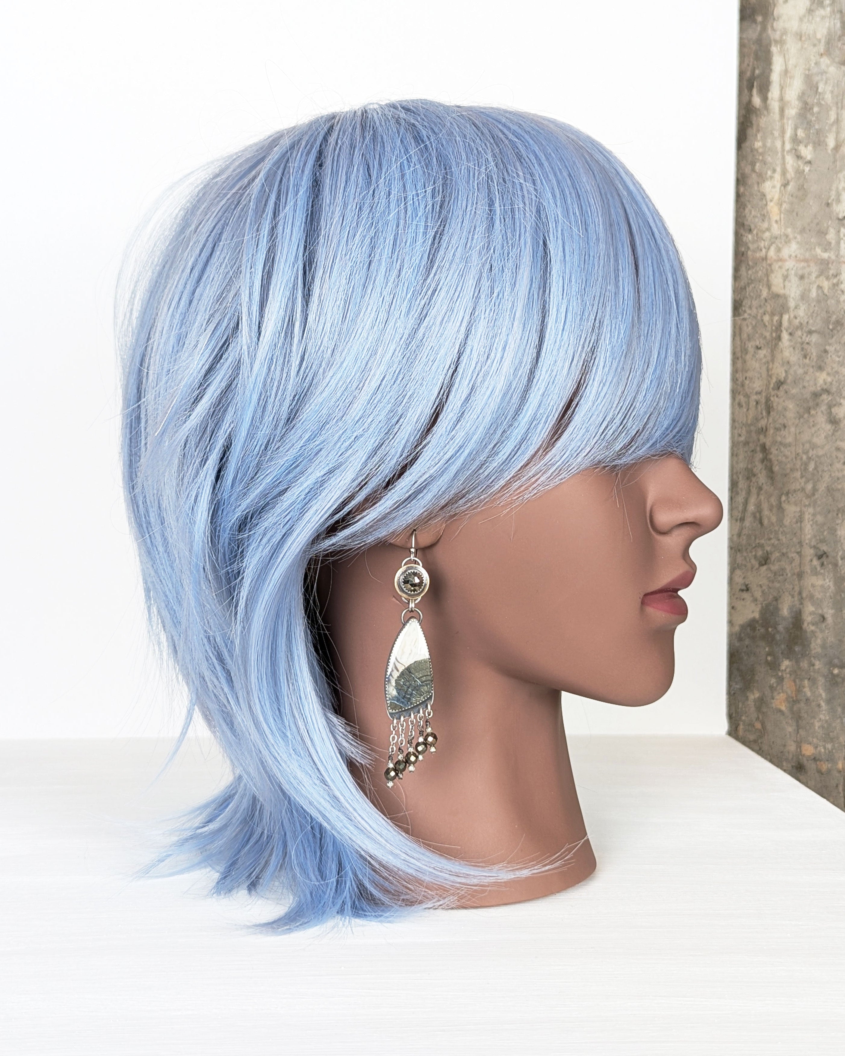 Artisan statement earrings with marcasite in agate and mixed metals on mannequin for scale