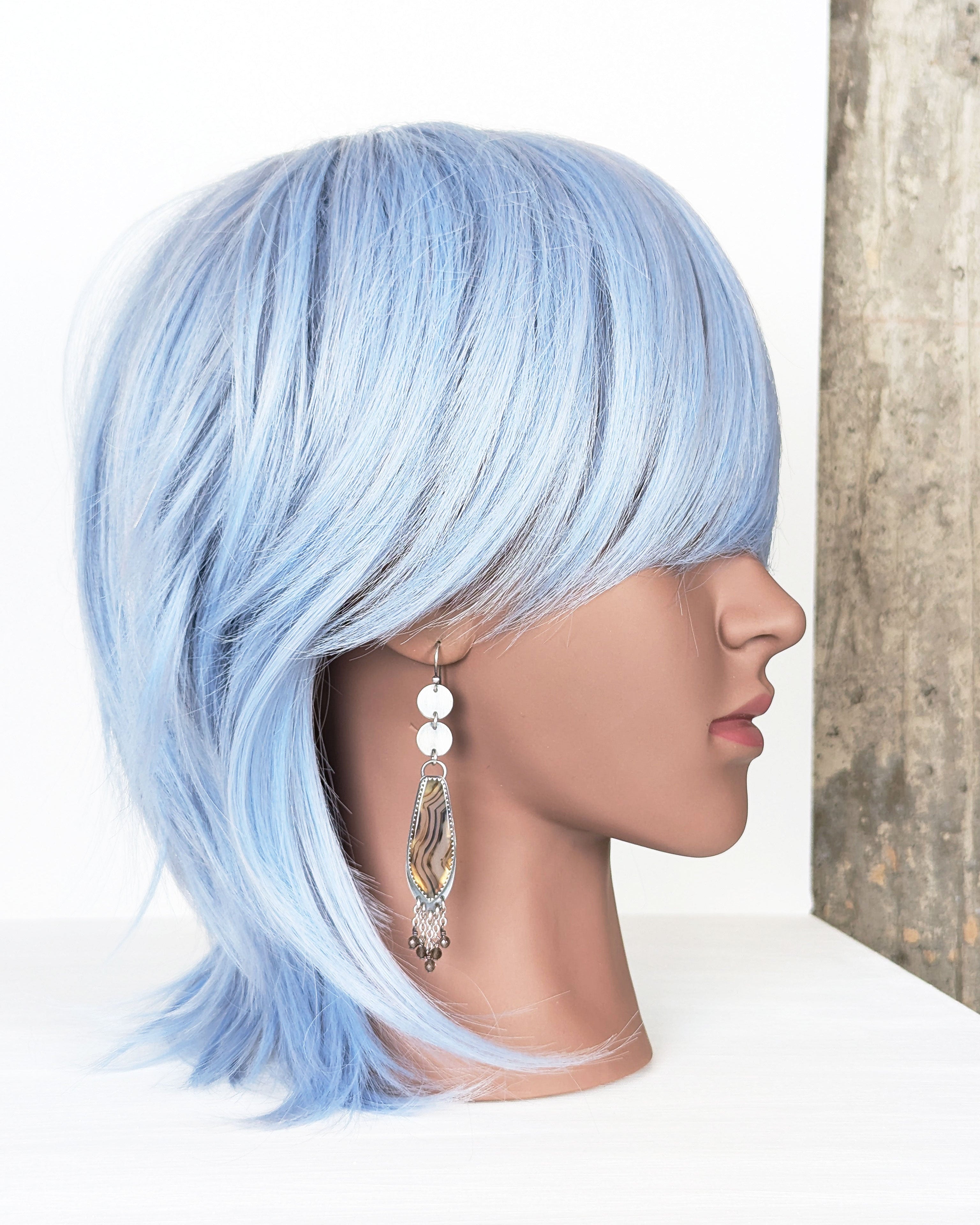 artisan handcrafted silver earrings with natural agate stones on mannequin for scale