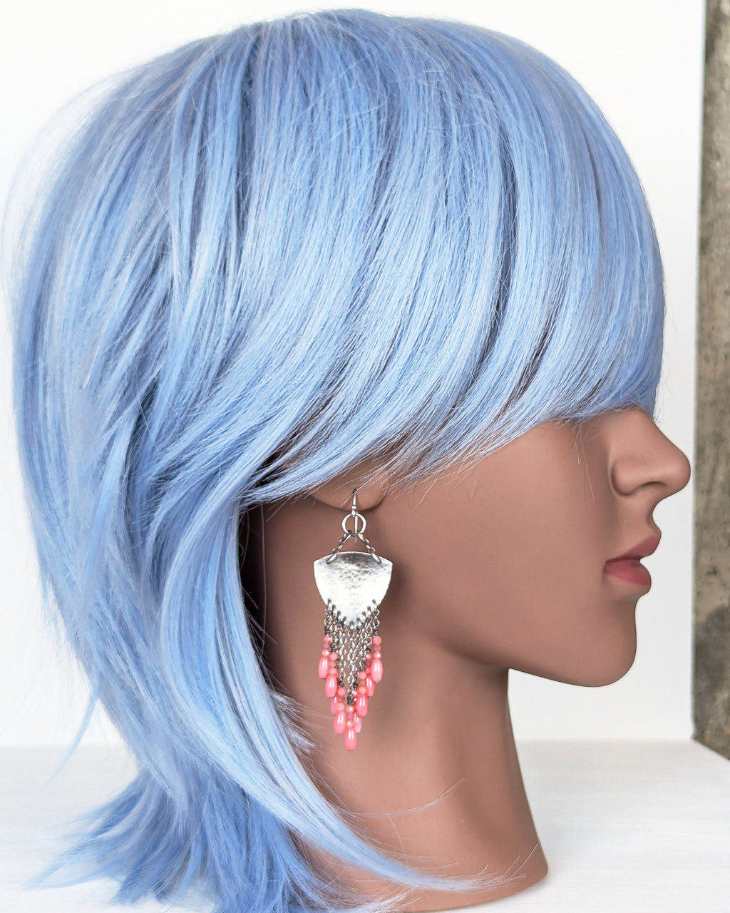 artisan chandelier earrings with soft pink gemstone accents on mannequin for scale