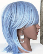 handcrafted oxidized silver earrings with glowing moonstone drops on mannequin for scale