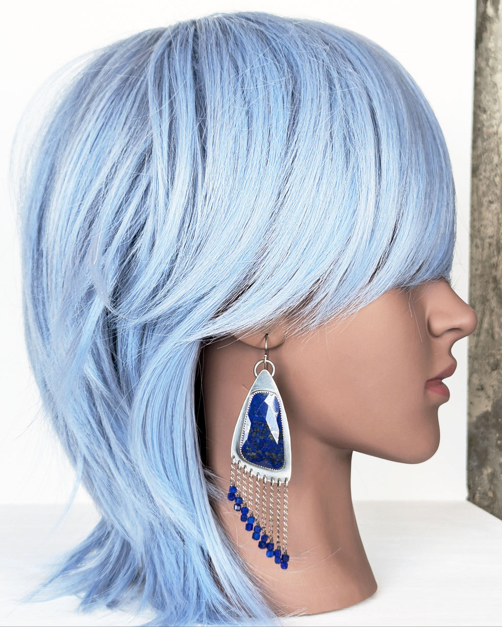 rose cut lapis lazuli earrings with cube bead fringe on mannequin for scale