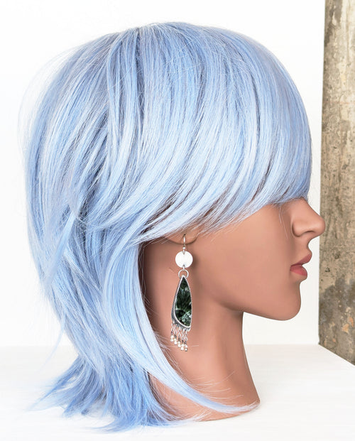 handcrafted oxidized silver earrings with pine green seraphinite on mannequin for scale