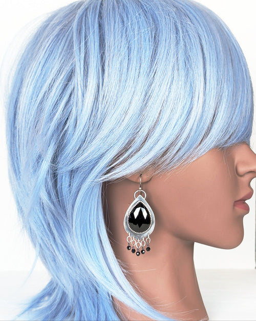 handcrafted oxidized silver earrings with black spinel stones on mannequin for scale