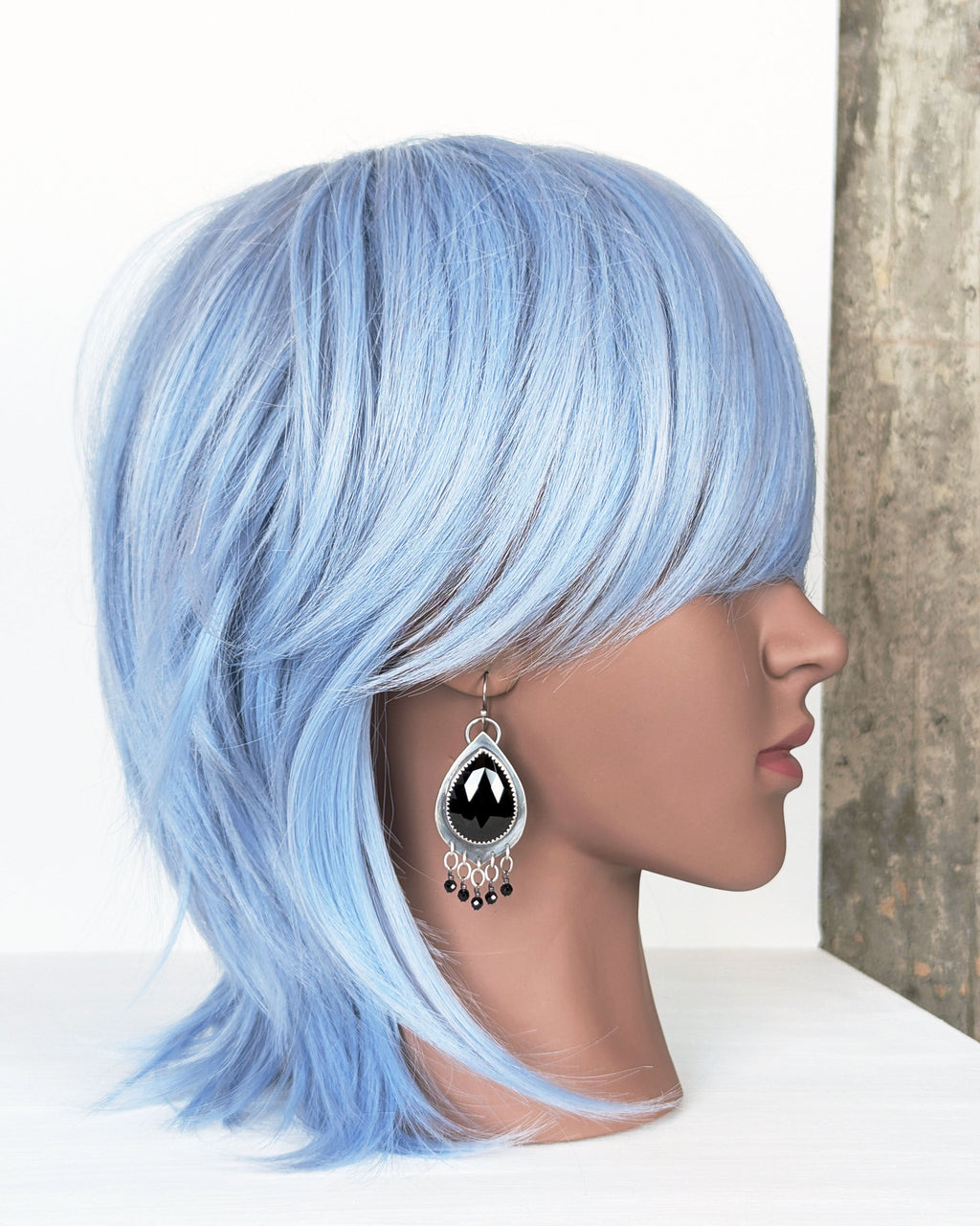 gothic inspired earrings with oxidized silver and spinel on mannequin for scale