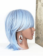 feminine artisan earrings with plume agate and beaded fringe on mannequin for scale