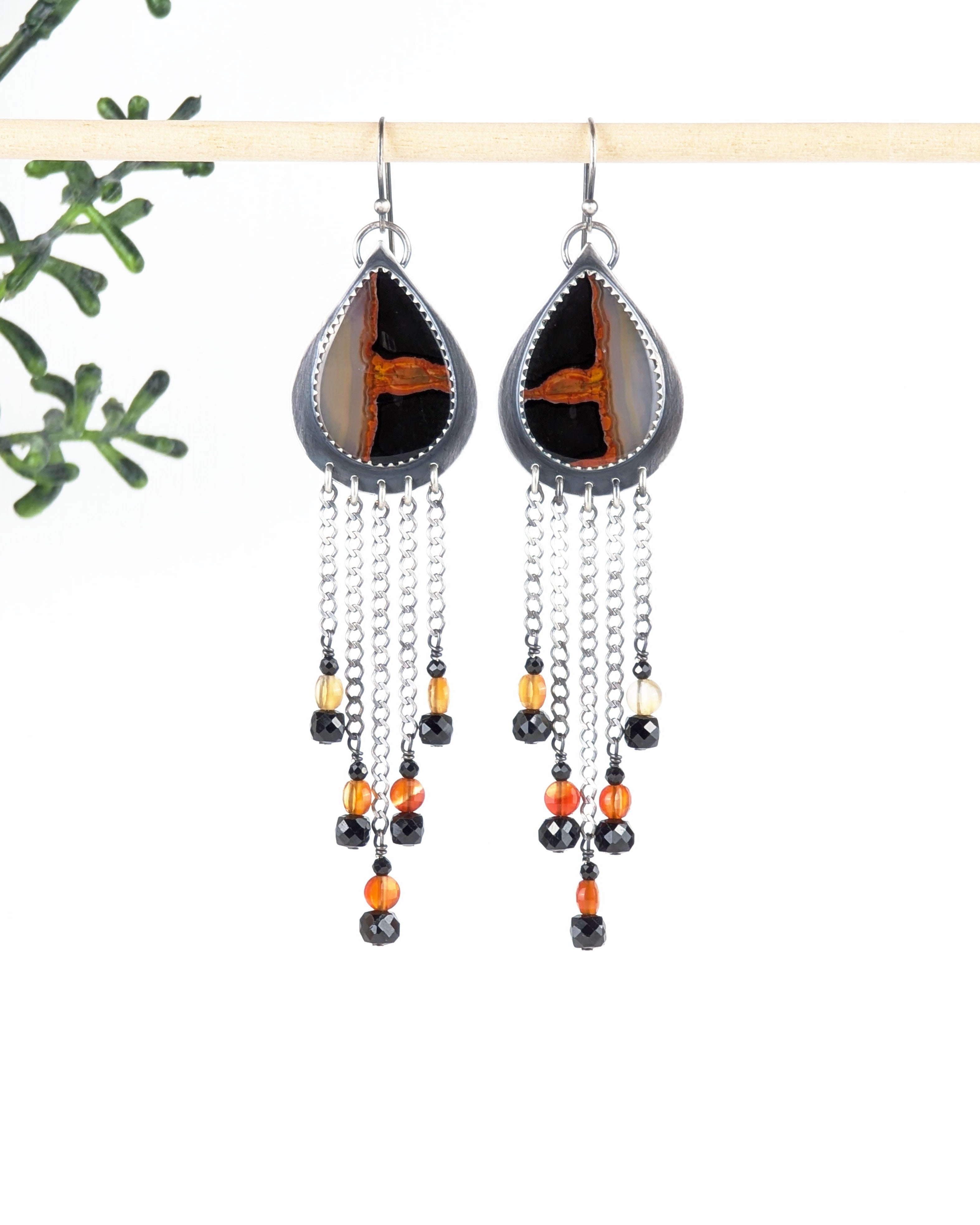 artisan silver earrings with dramatic v shaped chain fringe
