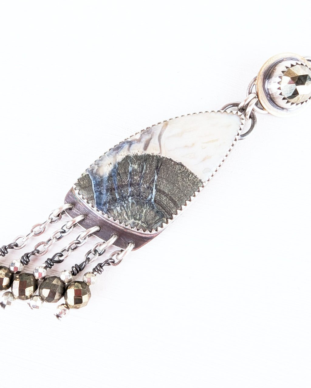 Close up of marcasite and agate stone earring