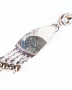Close up of marcasite and agate stone earring