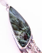Close up of seraphinite stone earrings