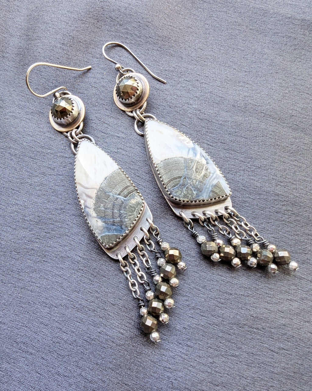 Bold mixed metal earrings with brass, pyrite, and agate design