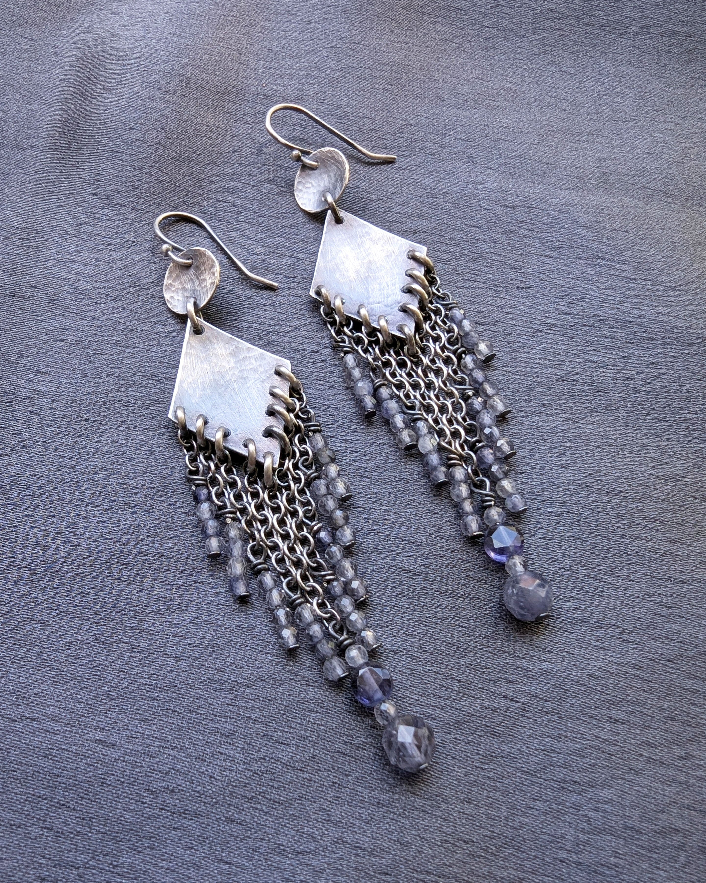 elegant fringe earrings with violet gemstones and silver design