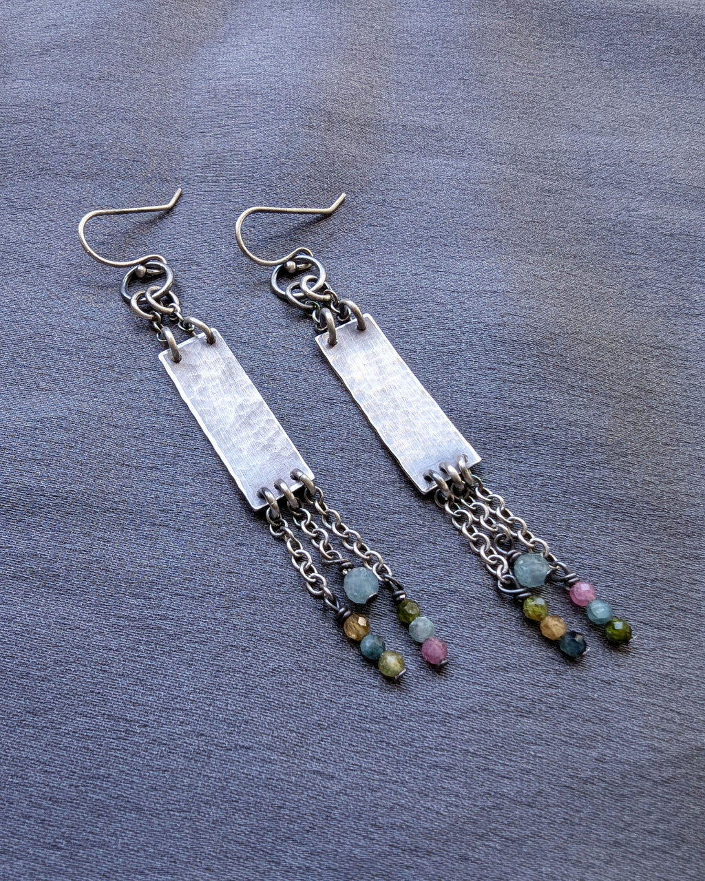 subtle statement earrings with rectangular silver and bead fringe