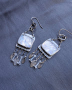 luminous gemstone earrings with soft blue flash and silver fringe