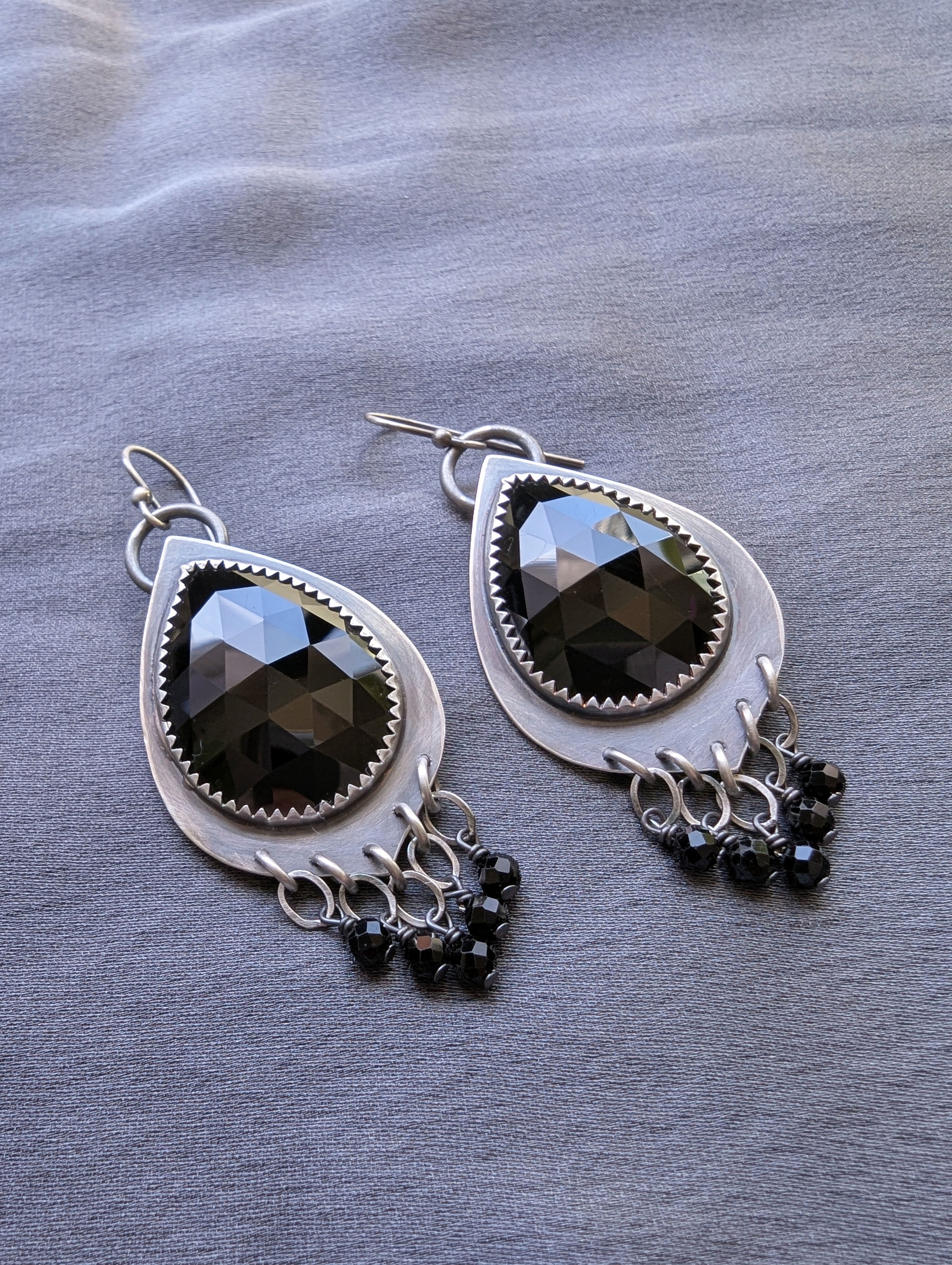 edgy silver earrings with black gemstone fringe