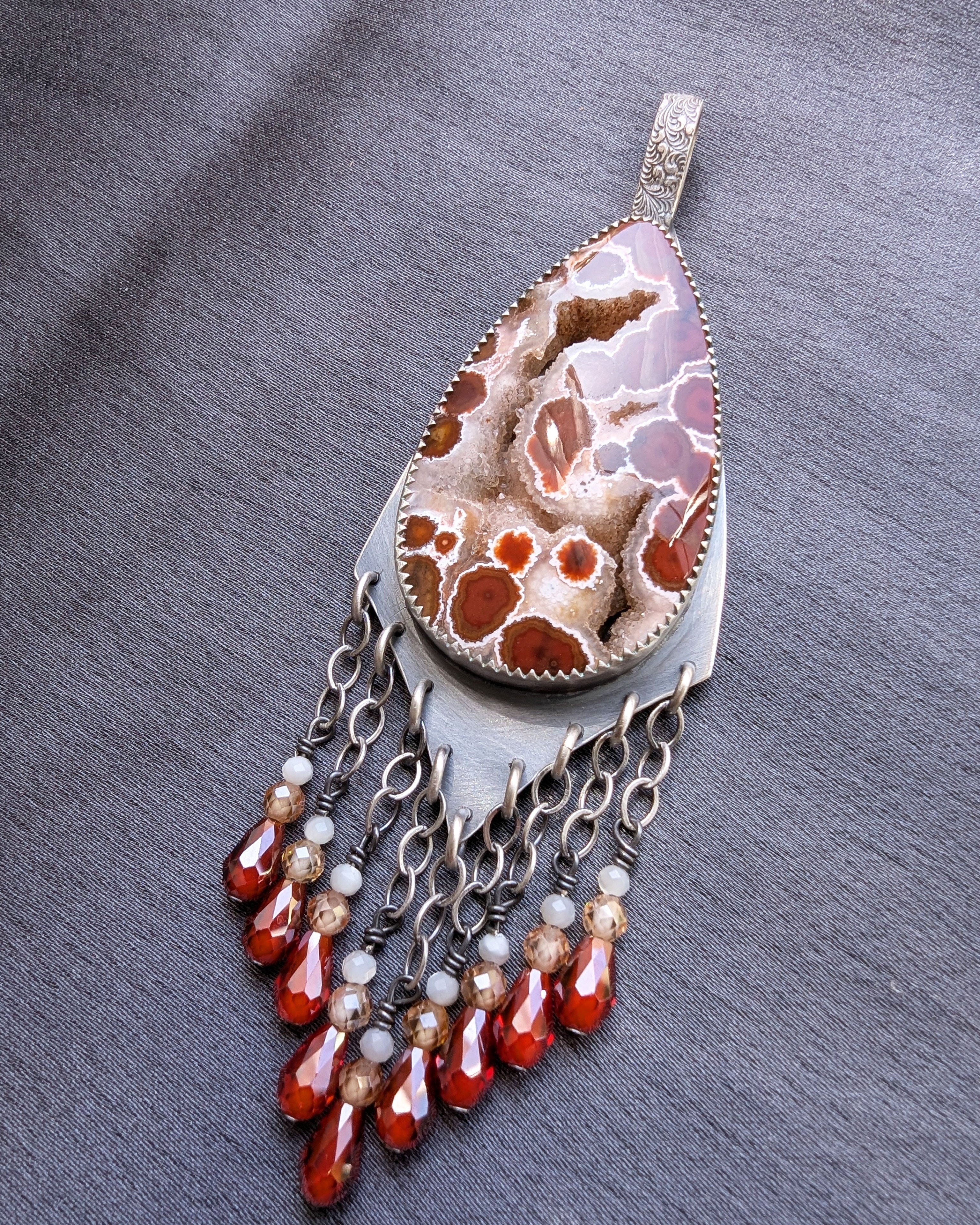 ocean jasper pendant with druzy crystal veins and bead fringe