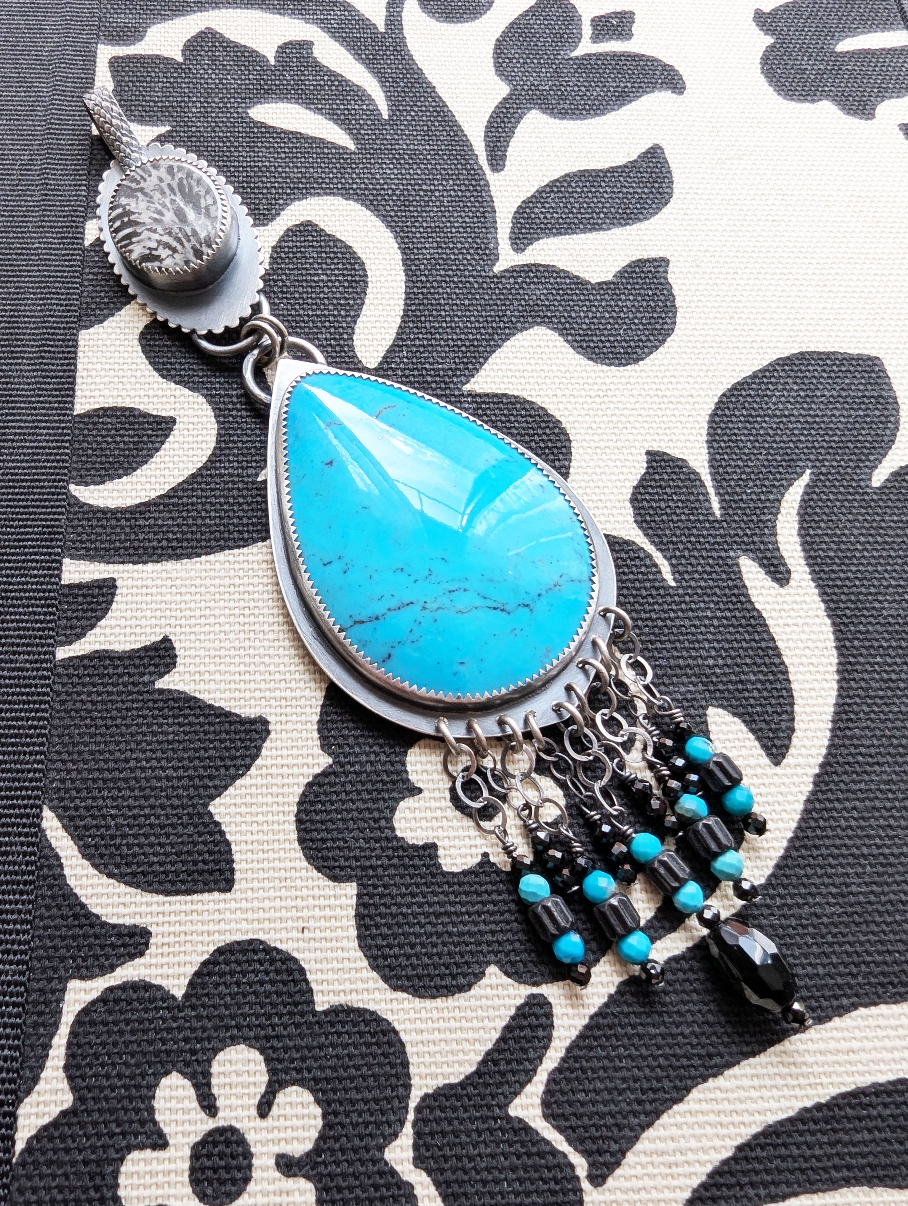 nacozari turquoise pendant with fossil coral bail and bead fringe