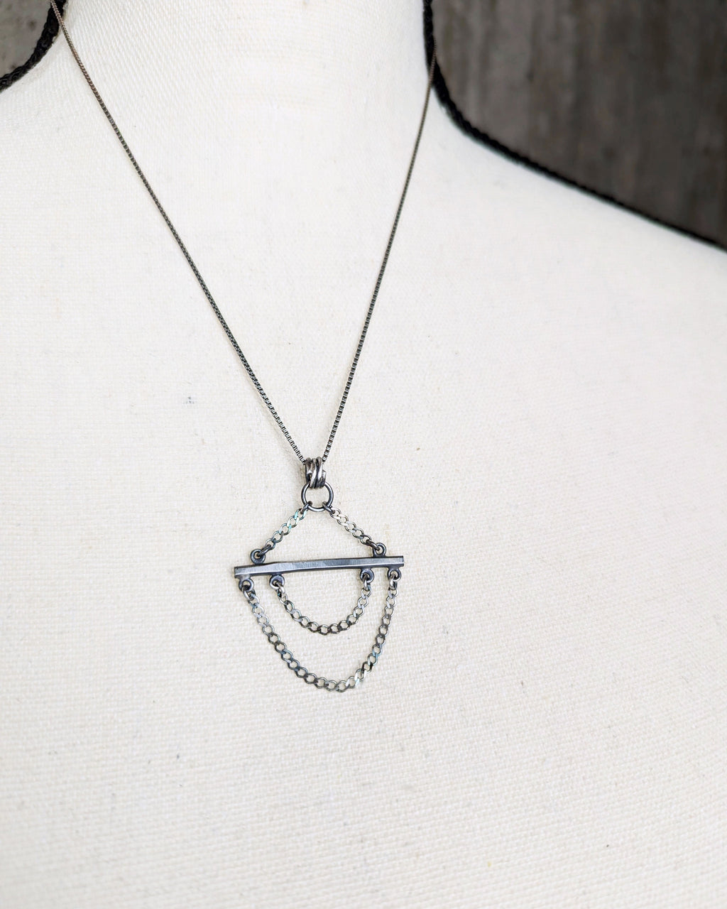 handcrafted silver pendant with forged bar and oxidized finish chain not included