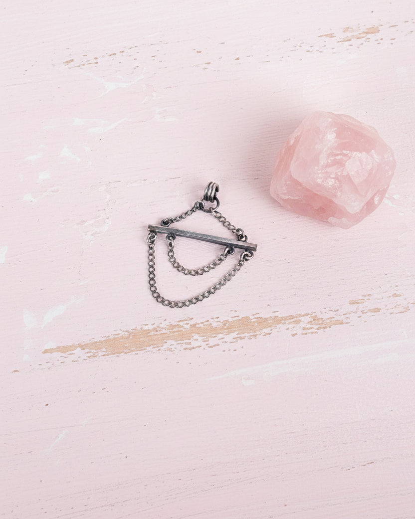 contemporary sterling silver statement pendant with chain details