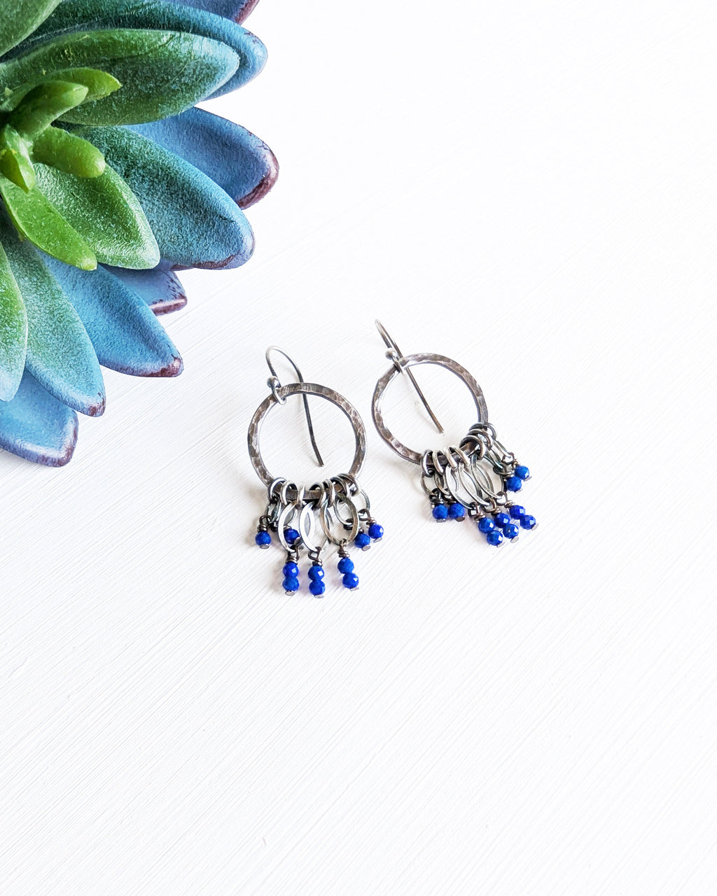 lightweight oxidized silver earrings with hammered hoops and gemstone details