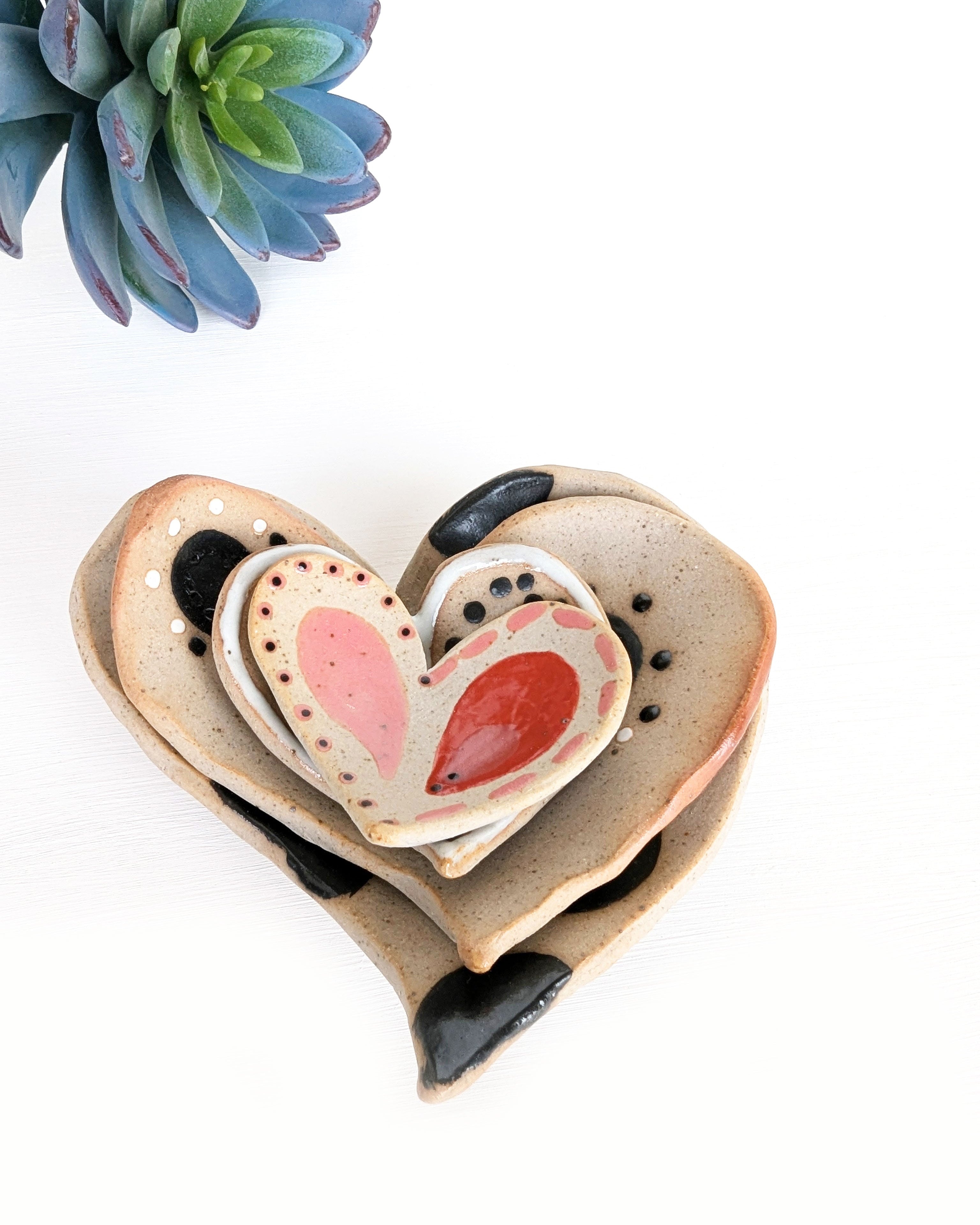 Hand-painted pottery heart dishes handmade in Colorado from speckled stoneware clay.