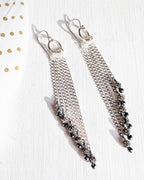 Edgy glam earrings with cascading silver chain movement