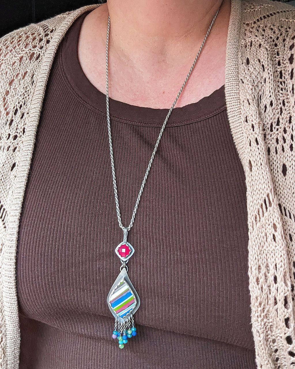 Asymmetrical chalcedony surfite necklace shown on bust for scale