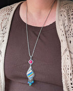 Asymmetrical chalcedony surfite necklace shown on bust for scale
