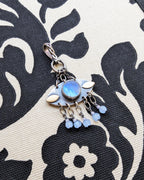 Blue flash moonstone evil eye pendant in oxidized sterling silver
