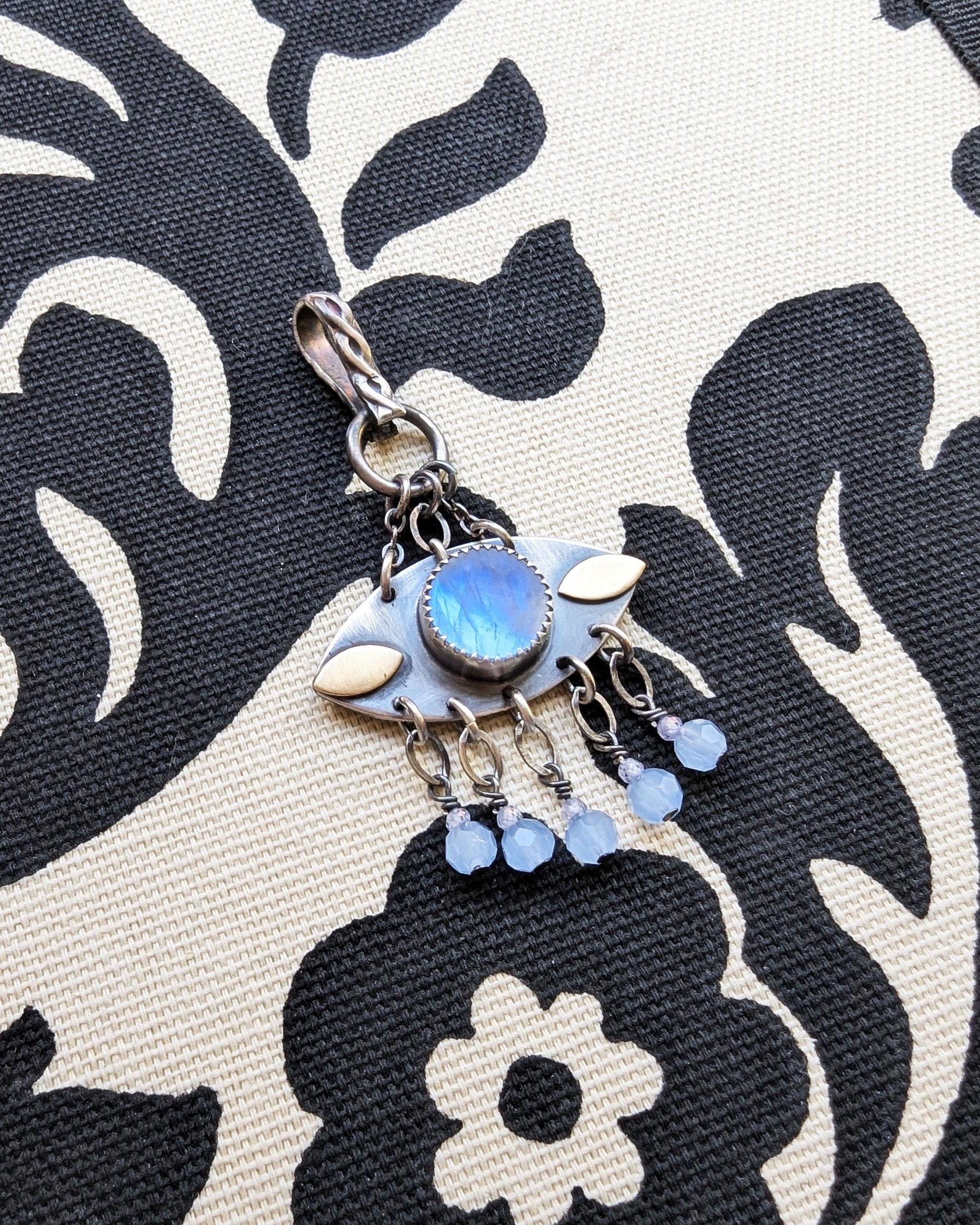 Blue flash moonstone evil eye pendant in oxidized sterling silver