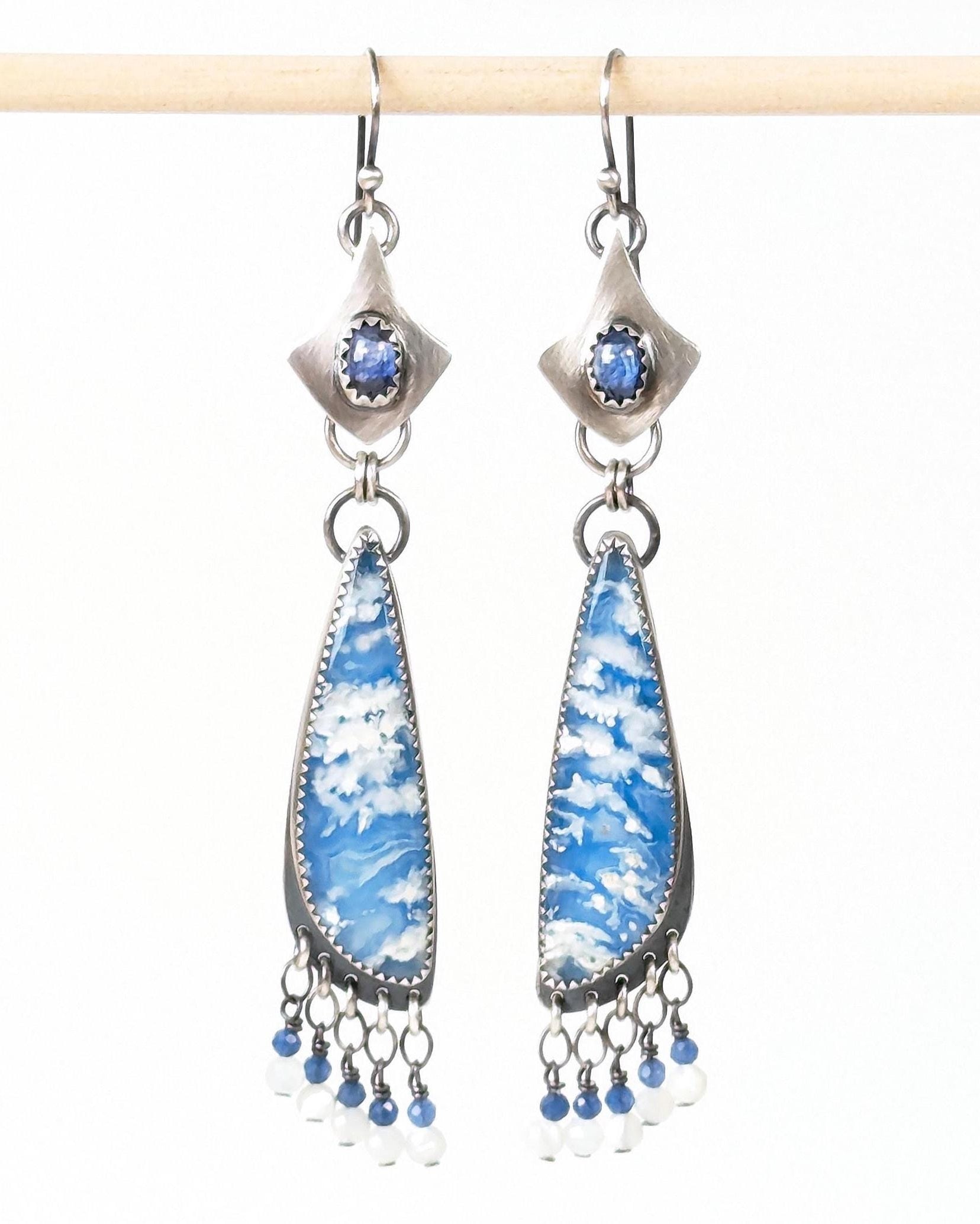 Blue sapphire and plume agate dangle earrings in sterling silver nge in bright light
