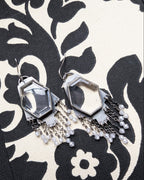 Close-up of hydro quartz stones framed in oxidized sterling silver earrings
