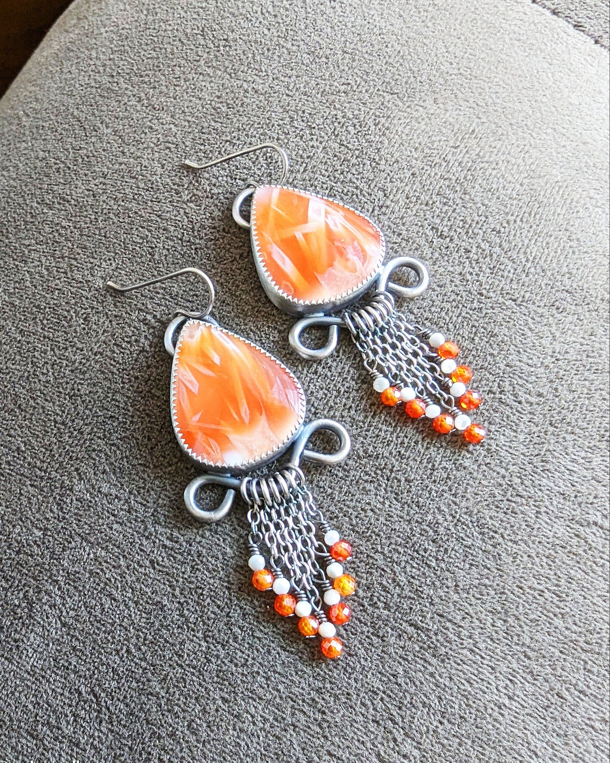 Tropical boho statement earrings with warm sunset palette