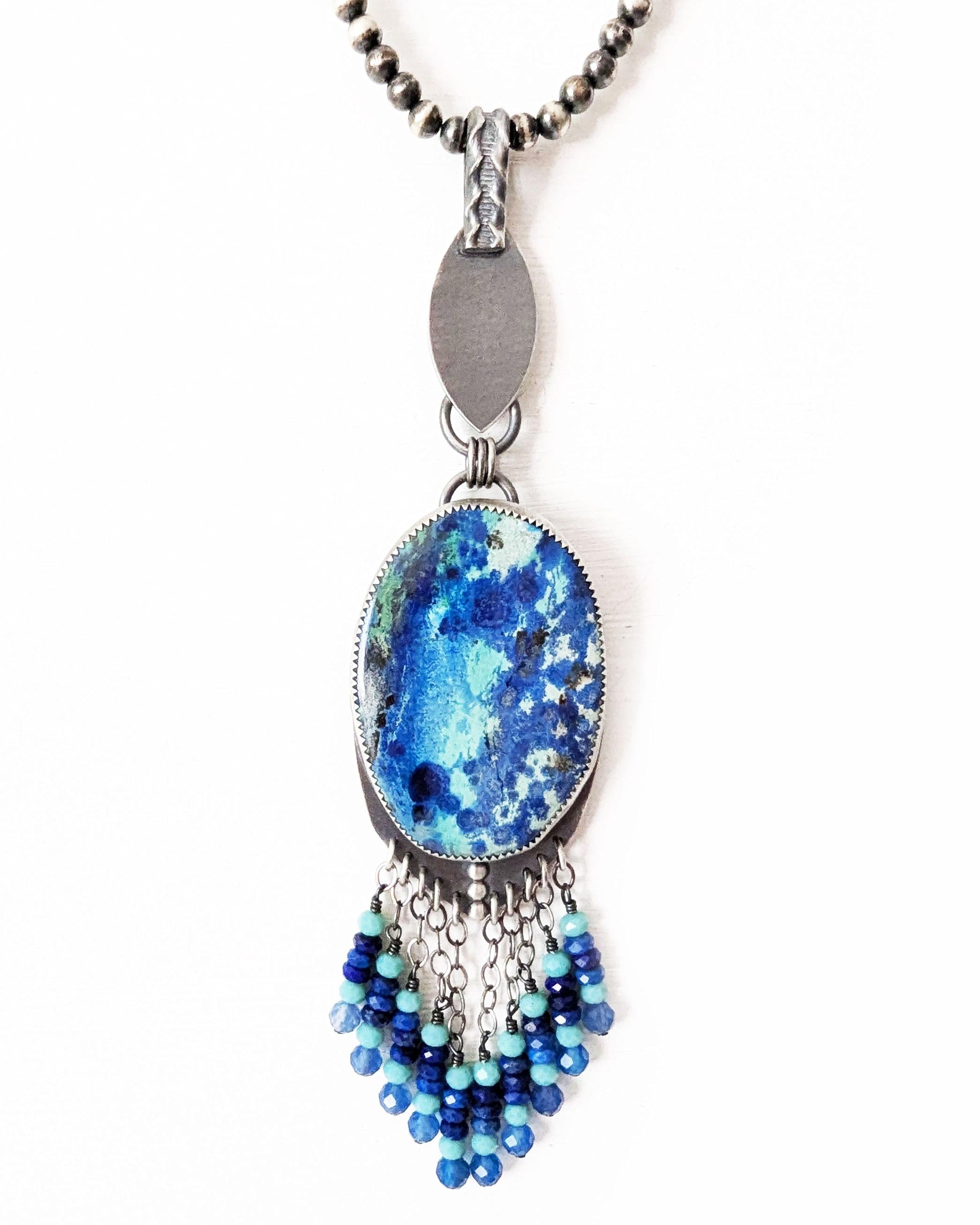 Oval bluebird azurite gemstone with aqua and cobalt swirling patterns on chain (not included)