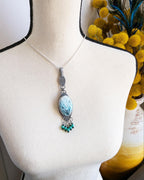 Artisan green gemstone pendant necklace handmade in sterling silver shown on bust for size in natural light