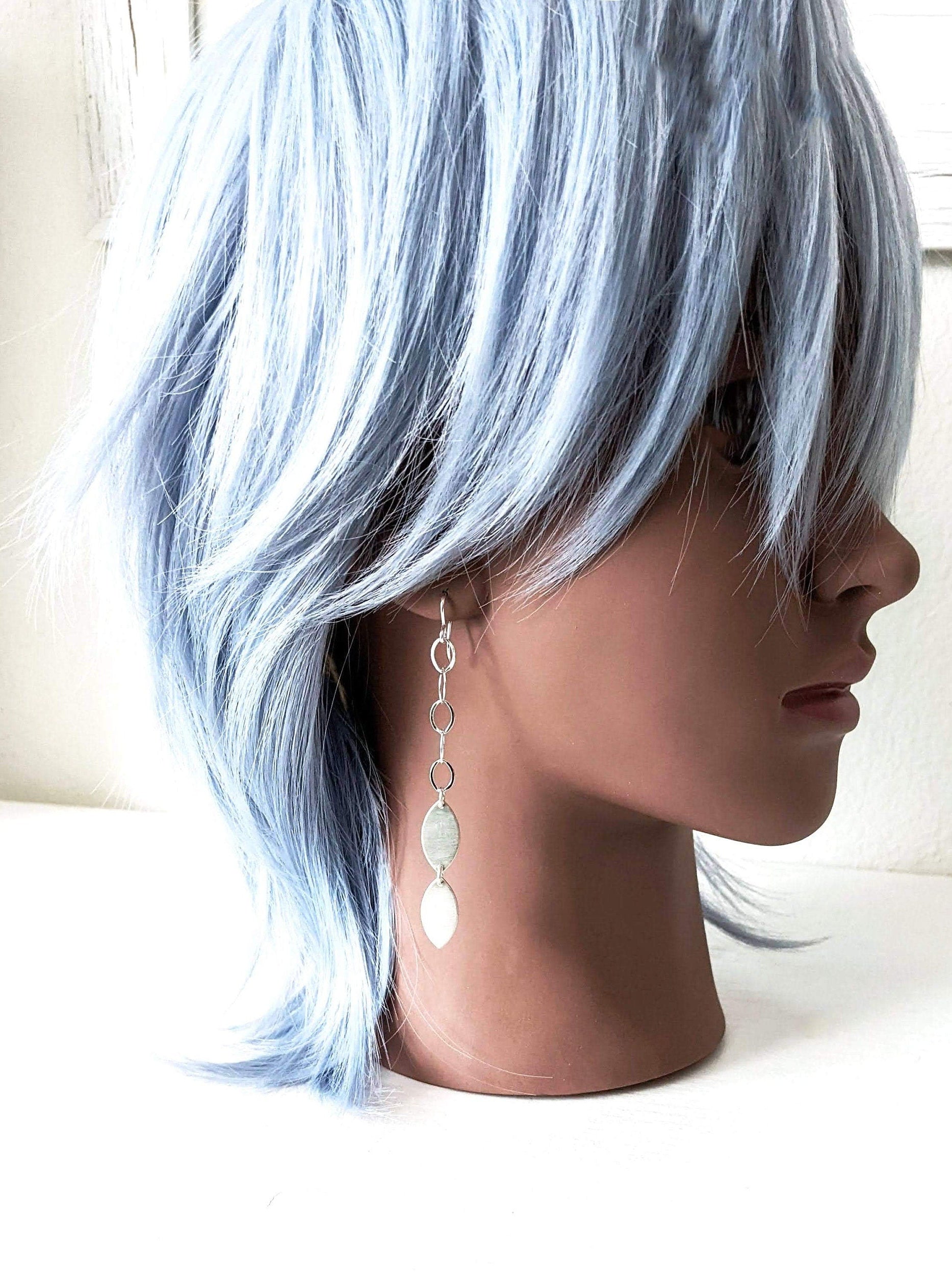 Versatile sterling silver drop earrings for casual or dressy looks on mannequin for scale
