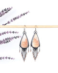Peach scolecite shield earrings in oxidized sterling silver with sunstone fringe