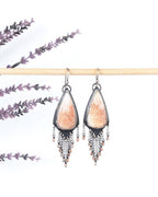 Peach scolecite shield earrings in oxidized sterling silver with sunstone fringe