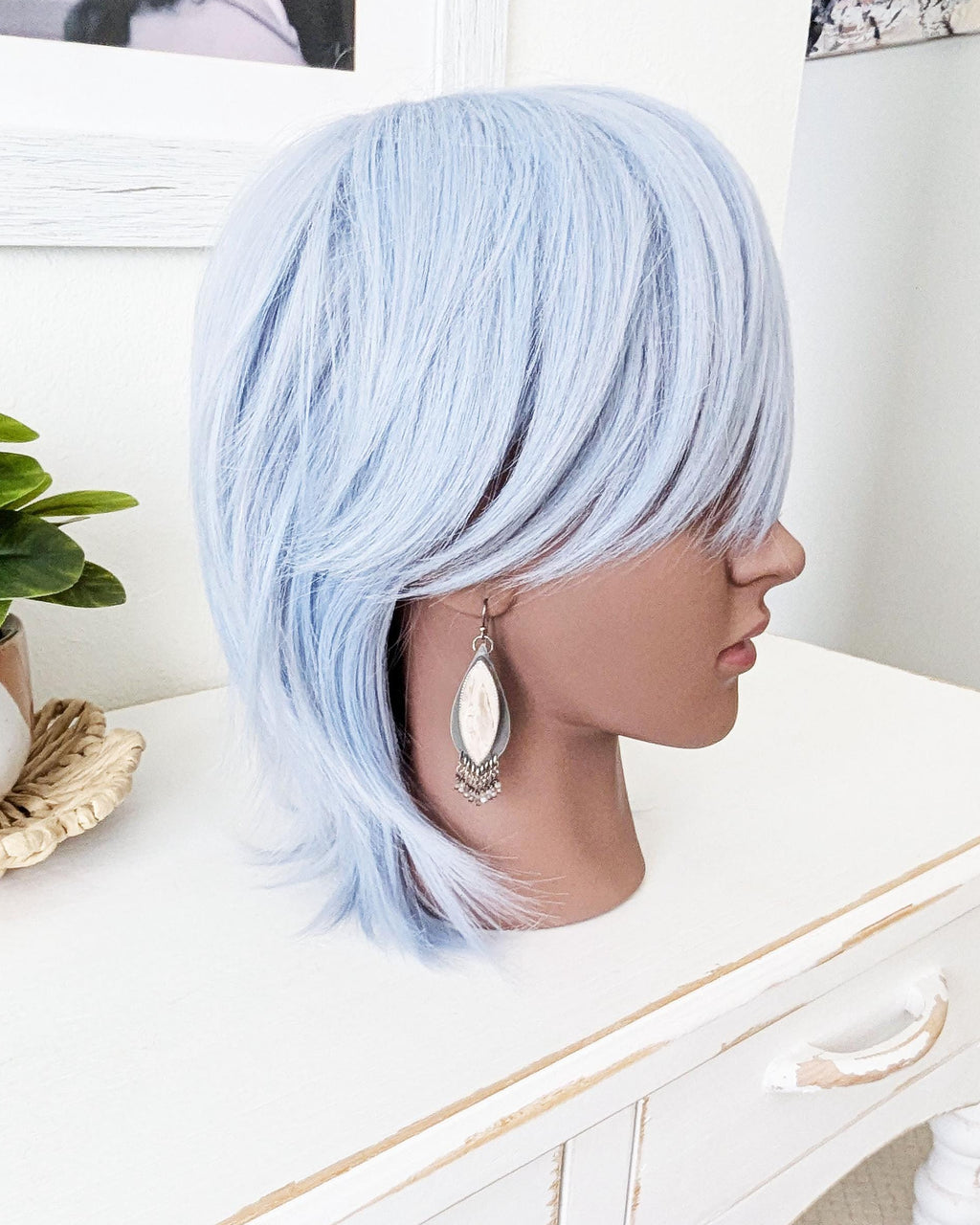 large gemstone earrings with beaded fringe on mannequin for scale