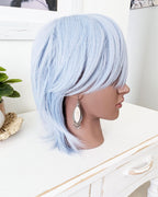 large gemstone earrings with beaded fringe on mannequin for scale