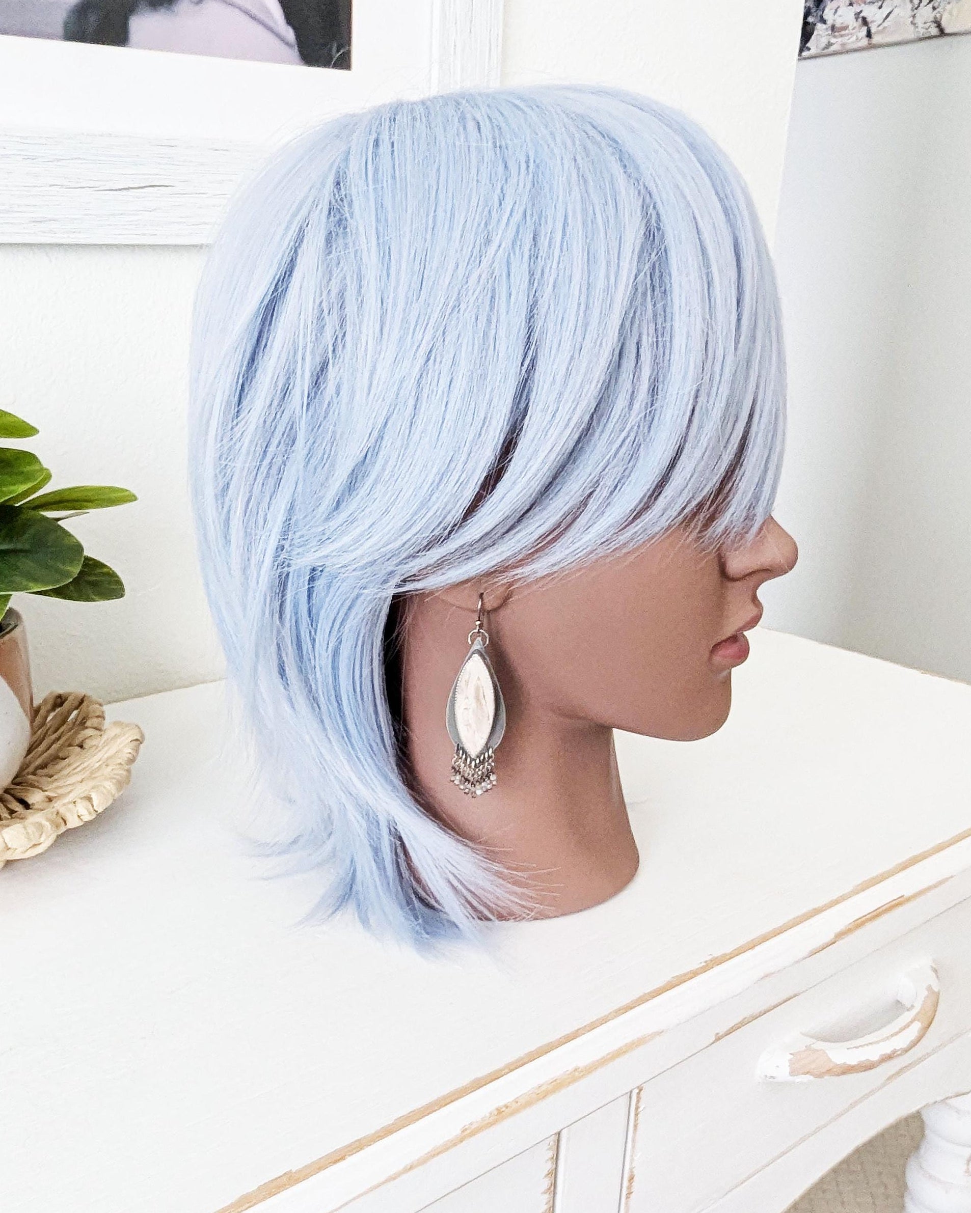 large gemstone earrings with beaded fringe on mannequin for scale