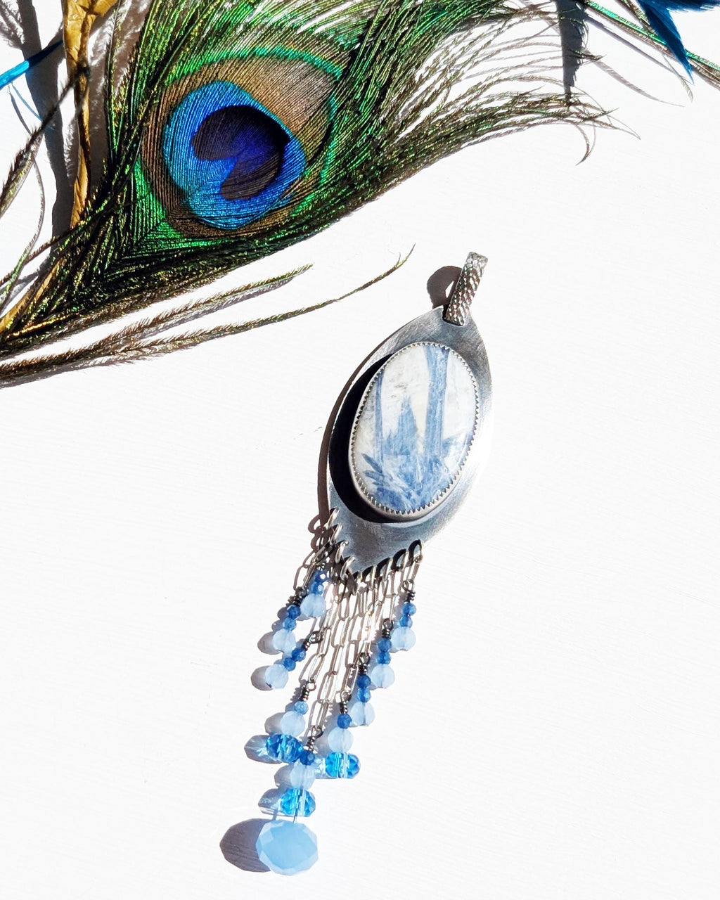 Marquis-shaped silver pendant with oval kyanite quartz stone