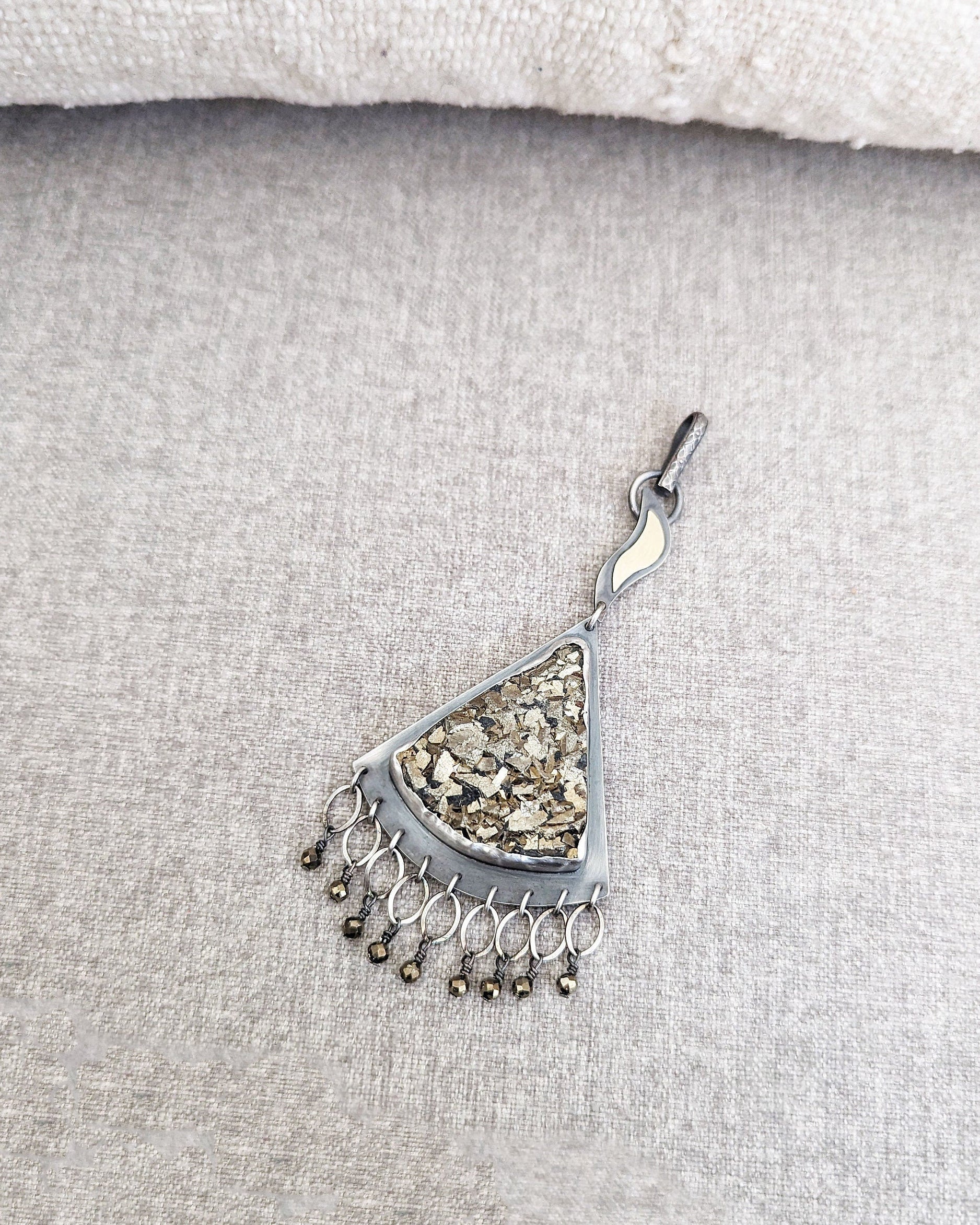 Triangular druzy pyrite pendant with flame-shaped handmade bail in oxidized silver