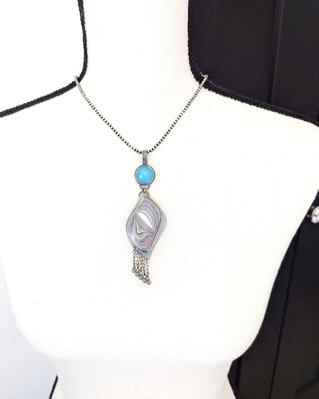 Artisan pendant by Rebellenhaus on bust for scale