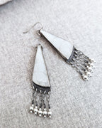 Oceanic artisan earrings featuring fossilized coral detail
