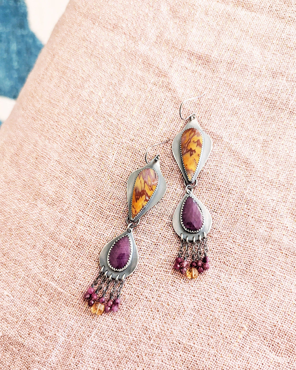 Collector gemstone duster earrings with vibrant magenta tones