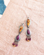 Collector gemstone duster earrings with vibrant magenta tones
