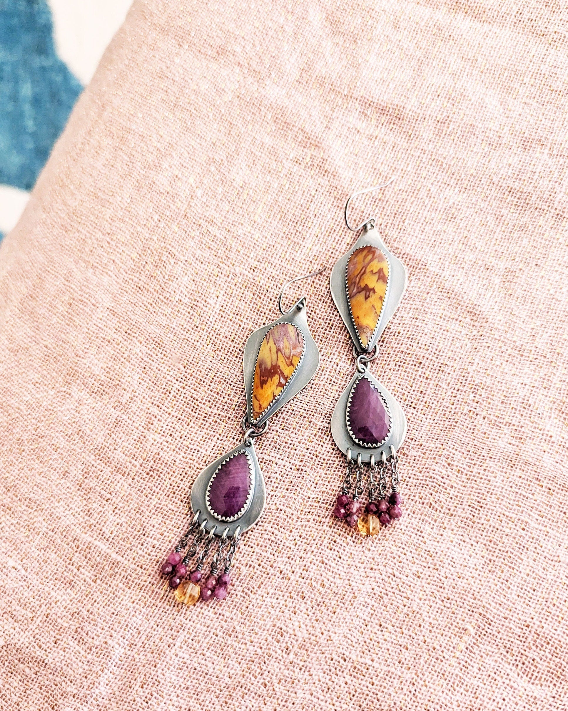 Collector gemstone duster earrings with vibrant magenta tones