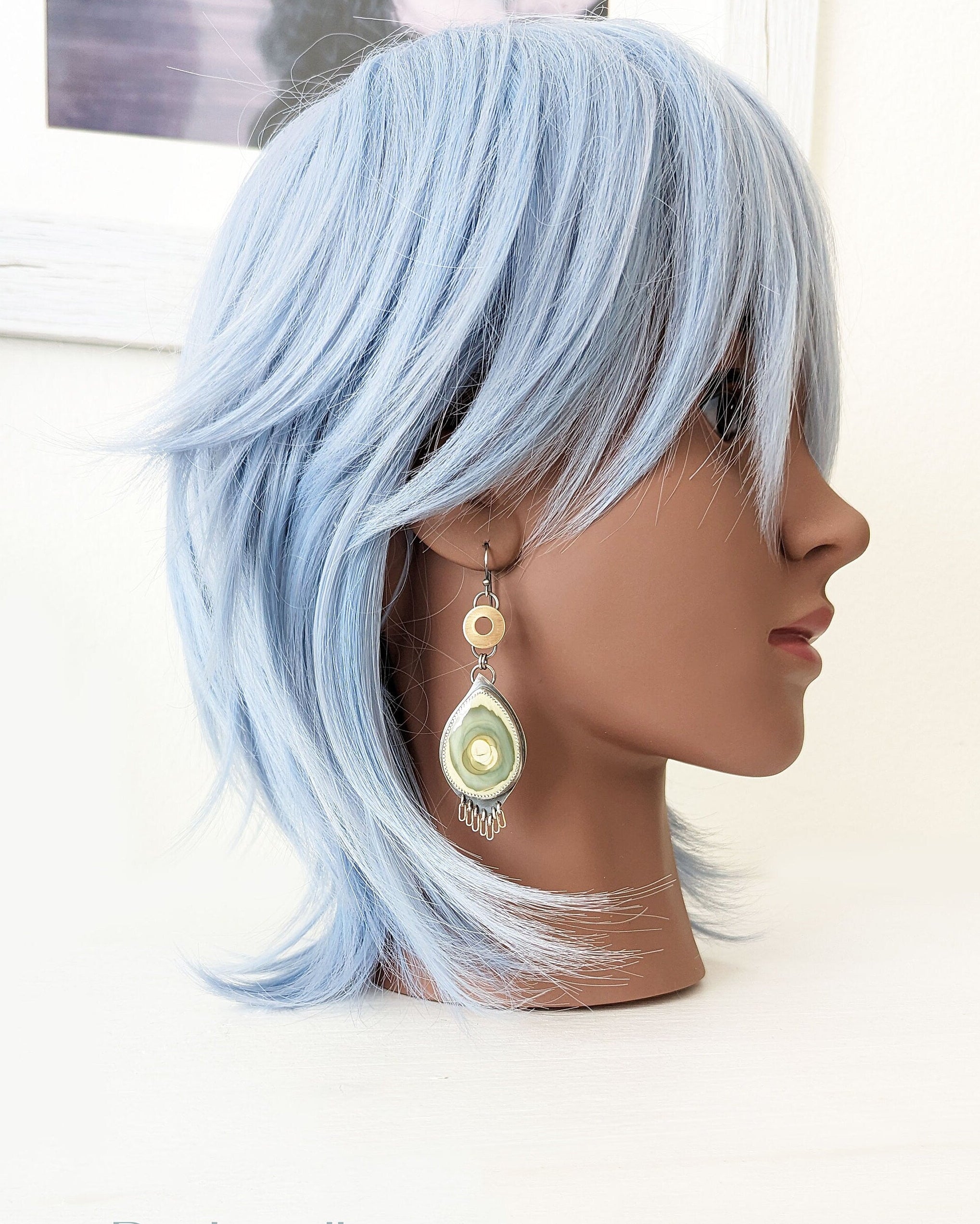 Collector gemstone earrings showcasing imperial jasper natural variation on mannequin for scale