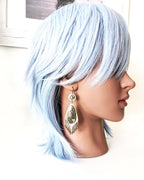 Artisan boho earrings with marcasite agate, pyrite sparkle, and silver fringe on a mannequin for scale