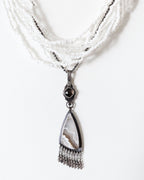 Neutral gemstone statement pendant with soft white and brown tones shown on chain and layer necklace (not Included)